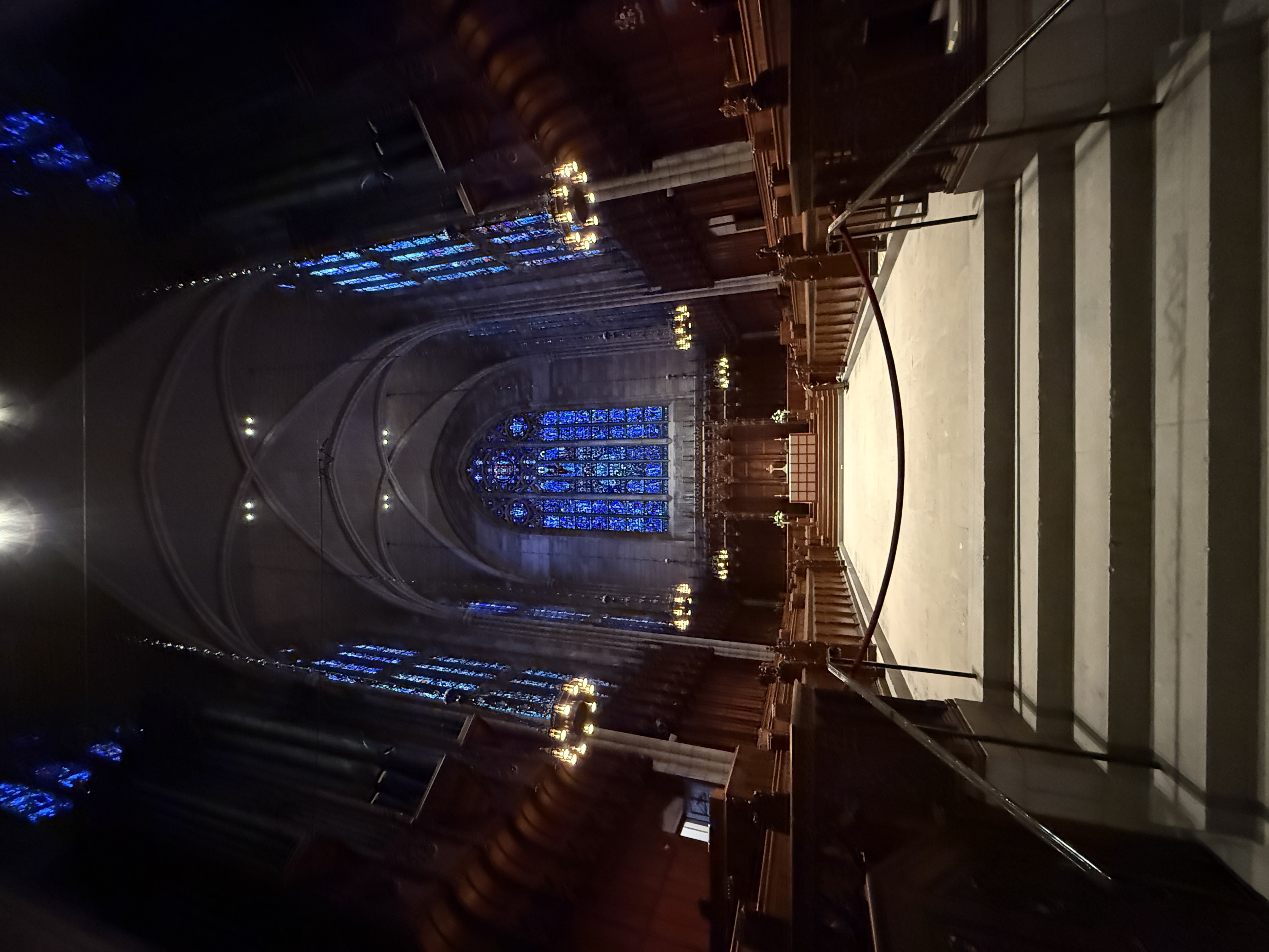 Wide sanctuary view framed by pointed arches leading toward the chancel